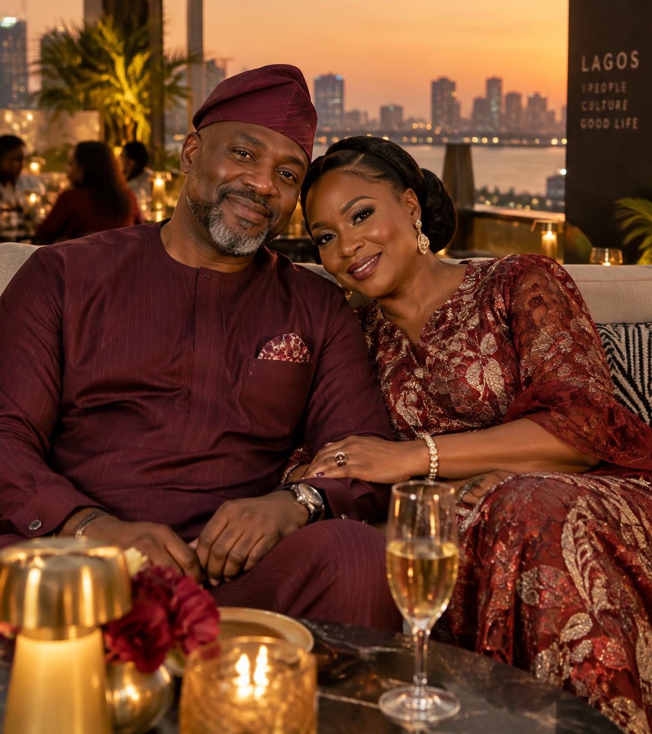 A smiling Nigerian couple in their forties at a Lagos rooftop lounge